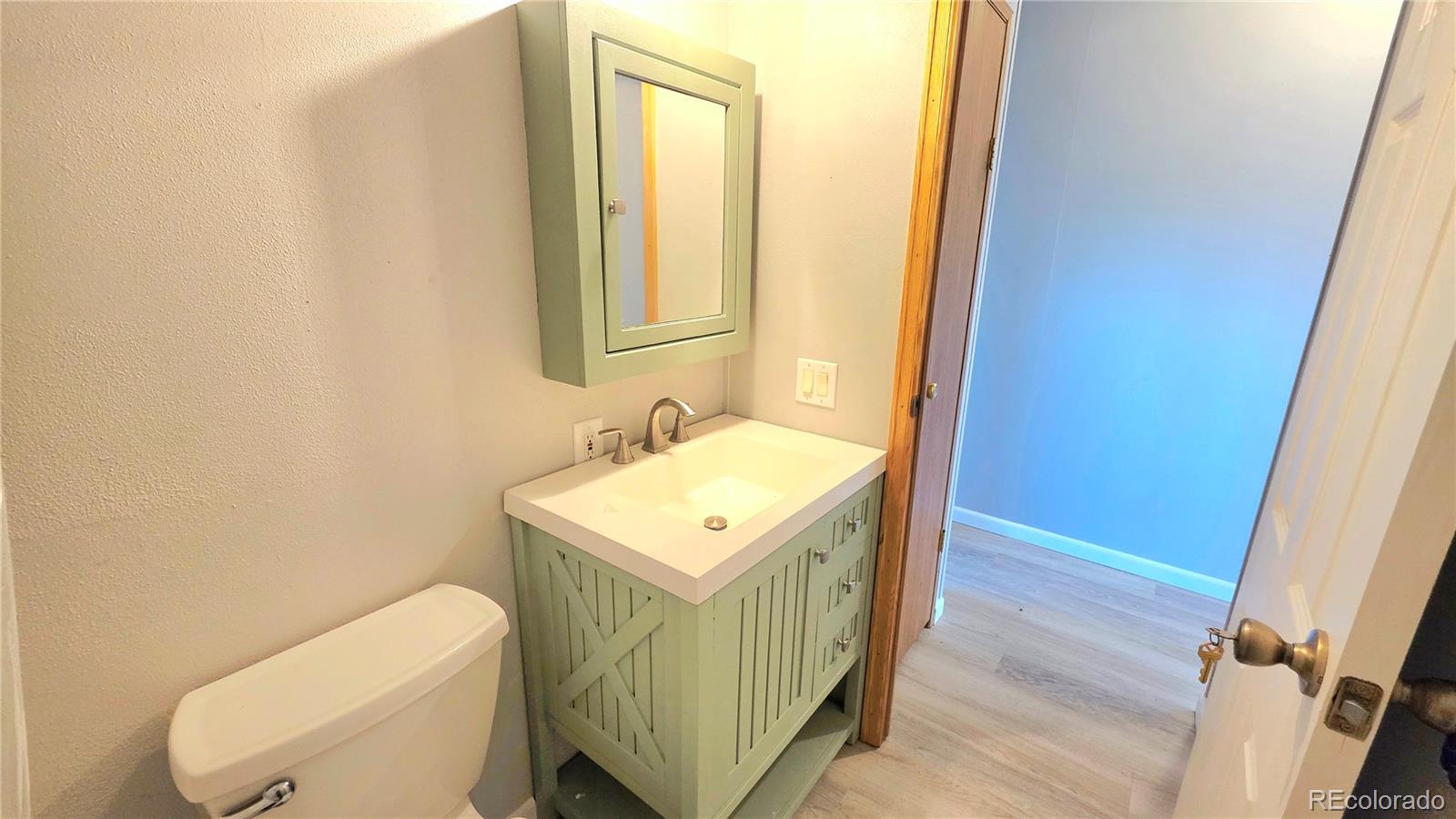 10754 County Road Olney Springs, CO 81062 - Photo 32 of 49 a bathroom with a sink toilet and mirror