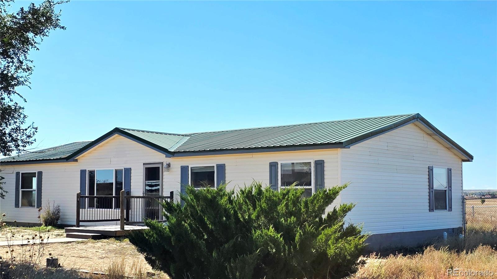 10754 County Road Olney Springs, CO 81062 - Photo 4 of 49 a view of a house with a yard