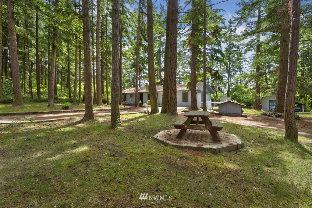 714 Ness' Corner Road Port Hadlock, WA 98339 - Photo 2 of 21 a swimming pool with trees in the background