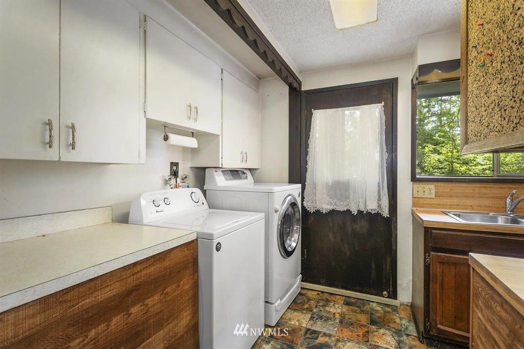 714 Ness' Corner Road Port Hadlock, WA 98339 - Photo 15 of 21 a utility room with sink dryer and washer