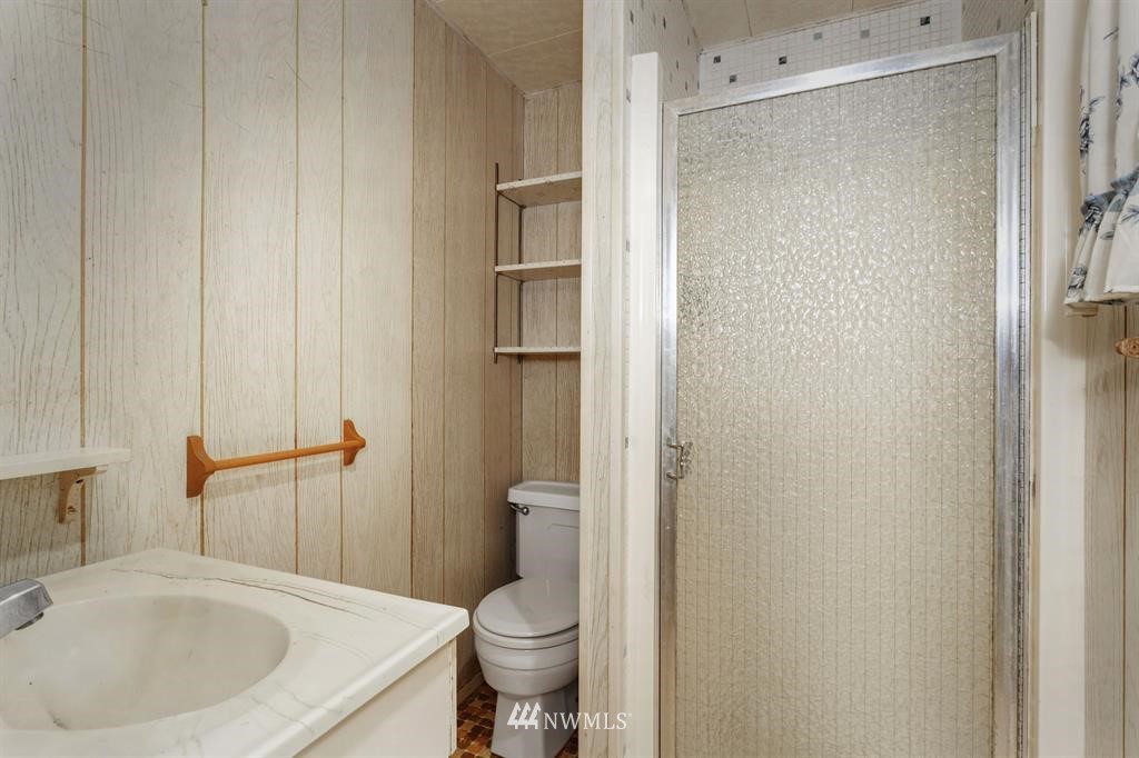714 Ness' Corner Road Port Hadlock, WA 98339 - Photo 17 of 21 a bathroom with a sink and toilet