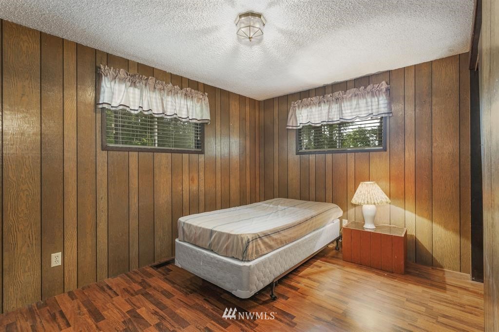 714 Ness' Corner Road Port Hadlock, WA 98339 - Photo 18 of 21 a bedroom with a bed and window