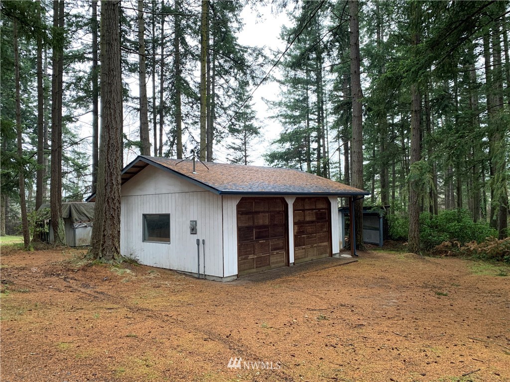 714 Ness' Corner Road Port Hadlock, WA 98339 - Photo 3 of 21 a view of a house with a yard and tree