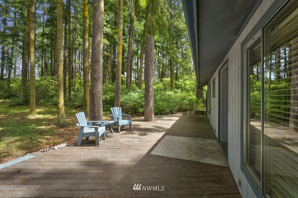 714 Ness' Corner Road Port Hadlock, WA 98339 - Photo 4 of 21 a view of backyard with seating area and green space