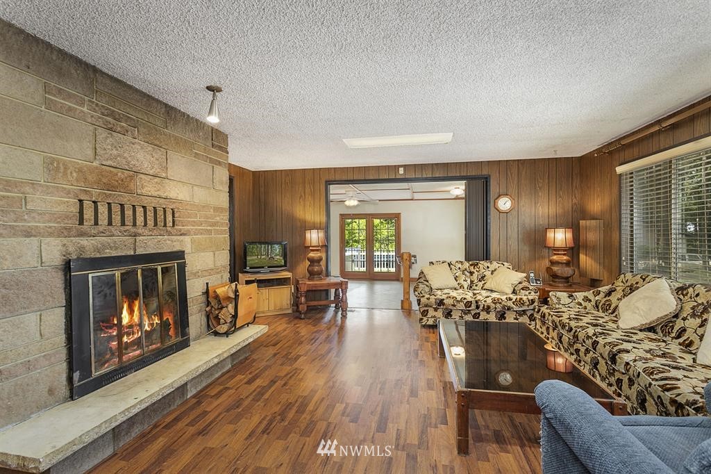 714 Ness' Corner Road Port Hadlock, WA 98339 - Photo 5 of 21 a living room with furniture and a fireplace