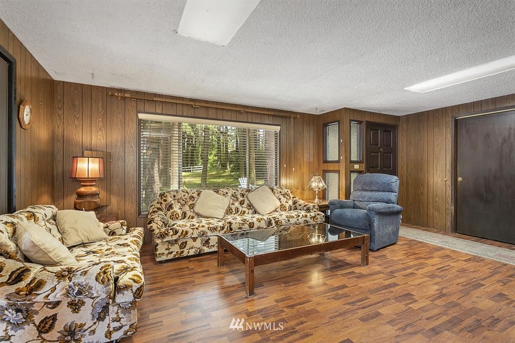 714 Ness' Corner Road Port Hadlock, WA 98339 - Photo 6 of 21 a living room with furniture and a large window