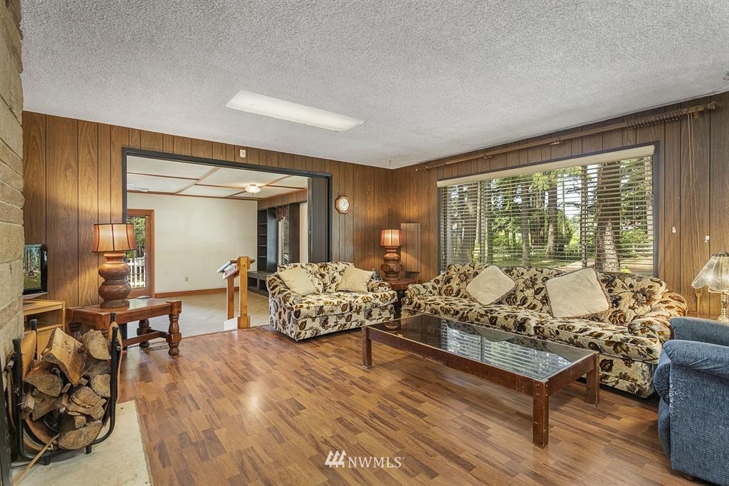 714 Ness' Corner Road Port Hadlock, WA 98339 - Photo 7 of 21 a living room with furniture and large windows