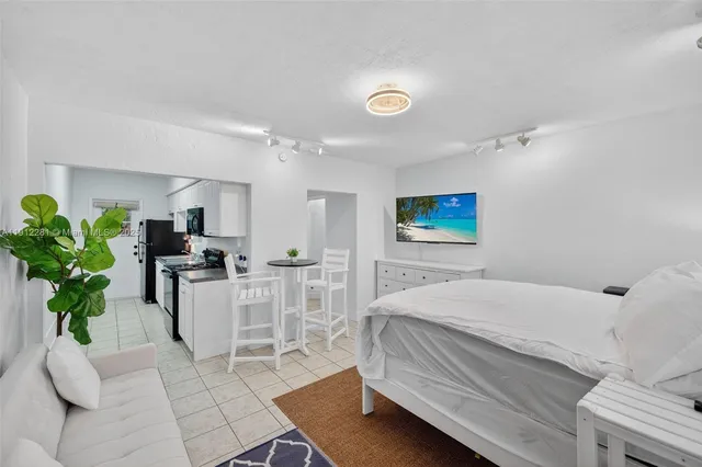 a bedroom with a bed and a couch