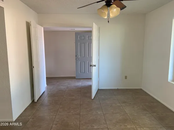 a view of a hallway with a wooden cabinets