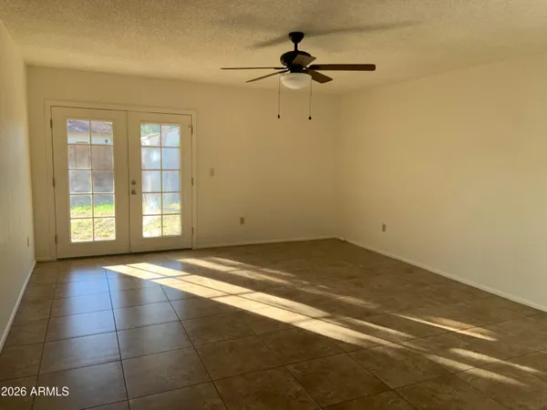 a view of a livingroom with a dishwasher and a window