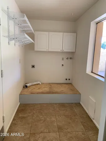 a room with cabinets and dust bin