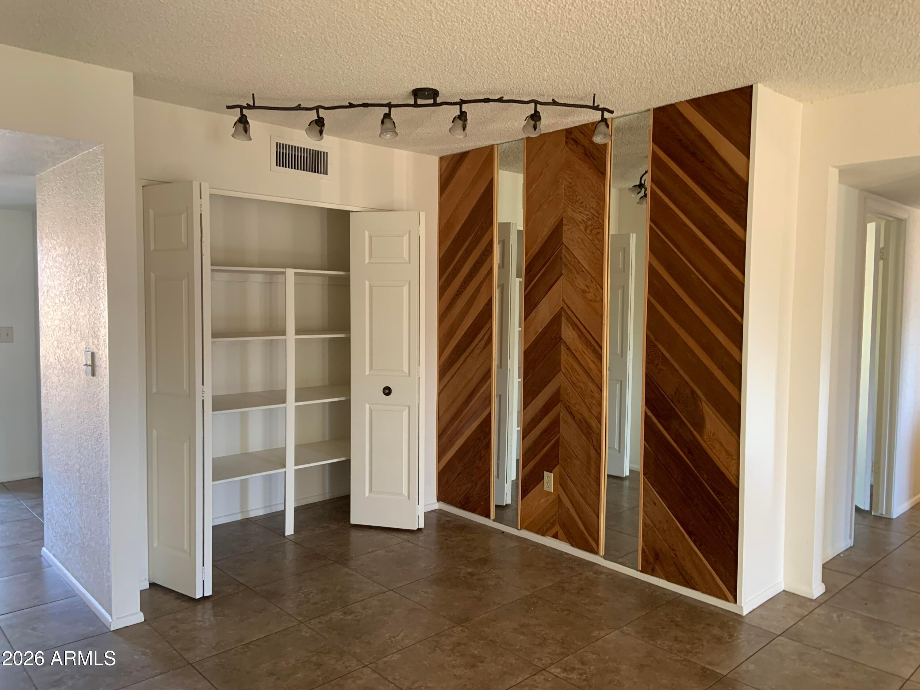17634 North 2nd Street Phoenix, AZ 85022 - Photo 4 of 29 a view of walk in closet with clothes and shoes
