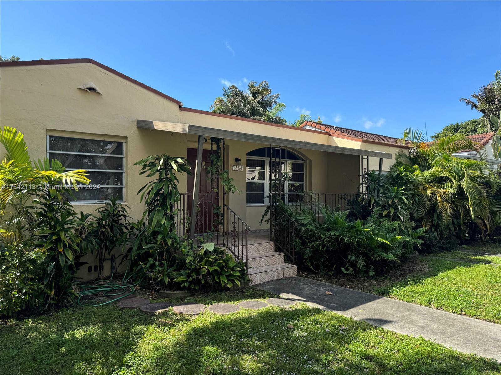 1854 Southwest 17th Street Miami, FL 33145 - Photo 2 of 13 a front view of house with a yard
