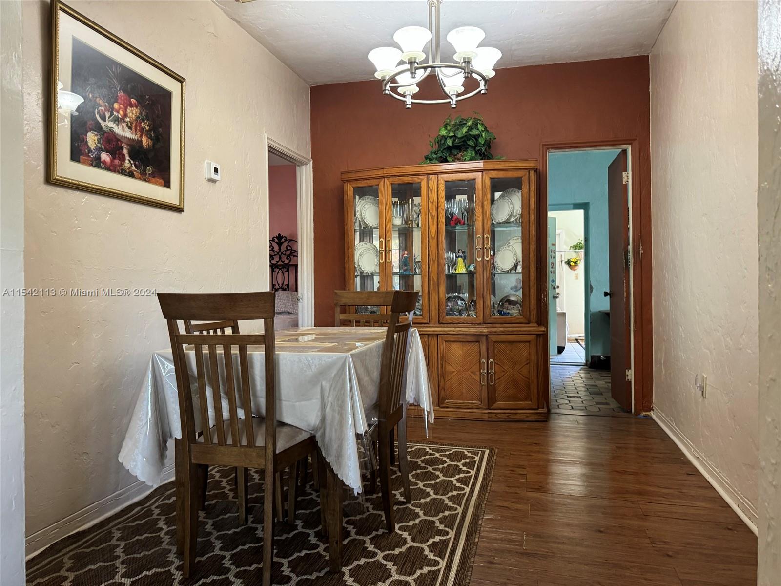 1854 Southwest 17th Street Miami, FL 33145 - Photo 5 of 13 a view of a dining room with furniture window and wooden floor