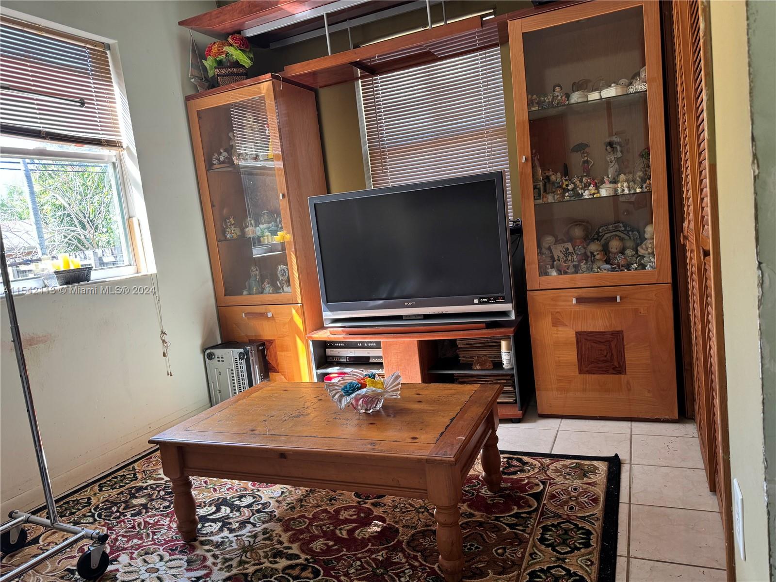 1854 Southwest 17th Street Miami, FL 33145 - Photo 9 of 13 a living room with furniture and a flat screen tv