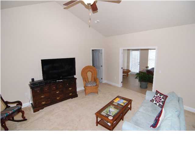 352 Bella Boulevard Santa Rosa Beach, FL 32459 - Photo 3 of 36 a living room with furniture and a flat screen tv
