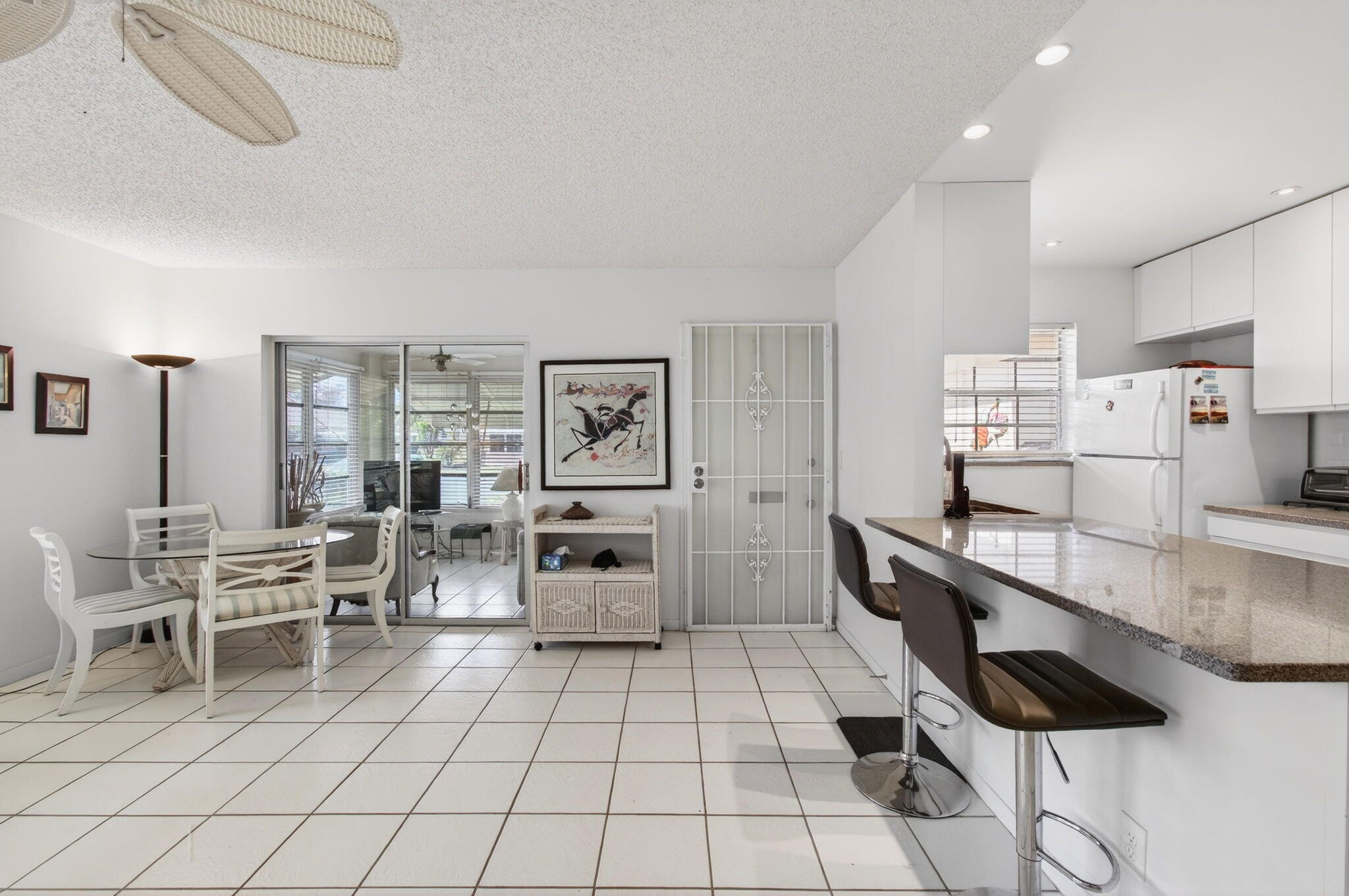 1327 High Point Way Southeast, Unit D Delray Beach, FL 33445 - Photo 12 of 53 Open concept kitchen and living room vie
