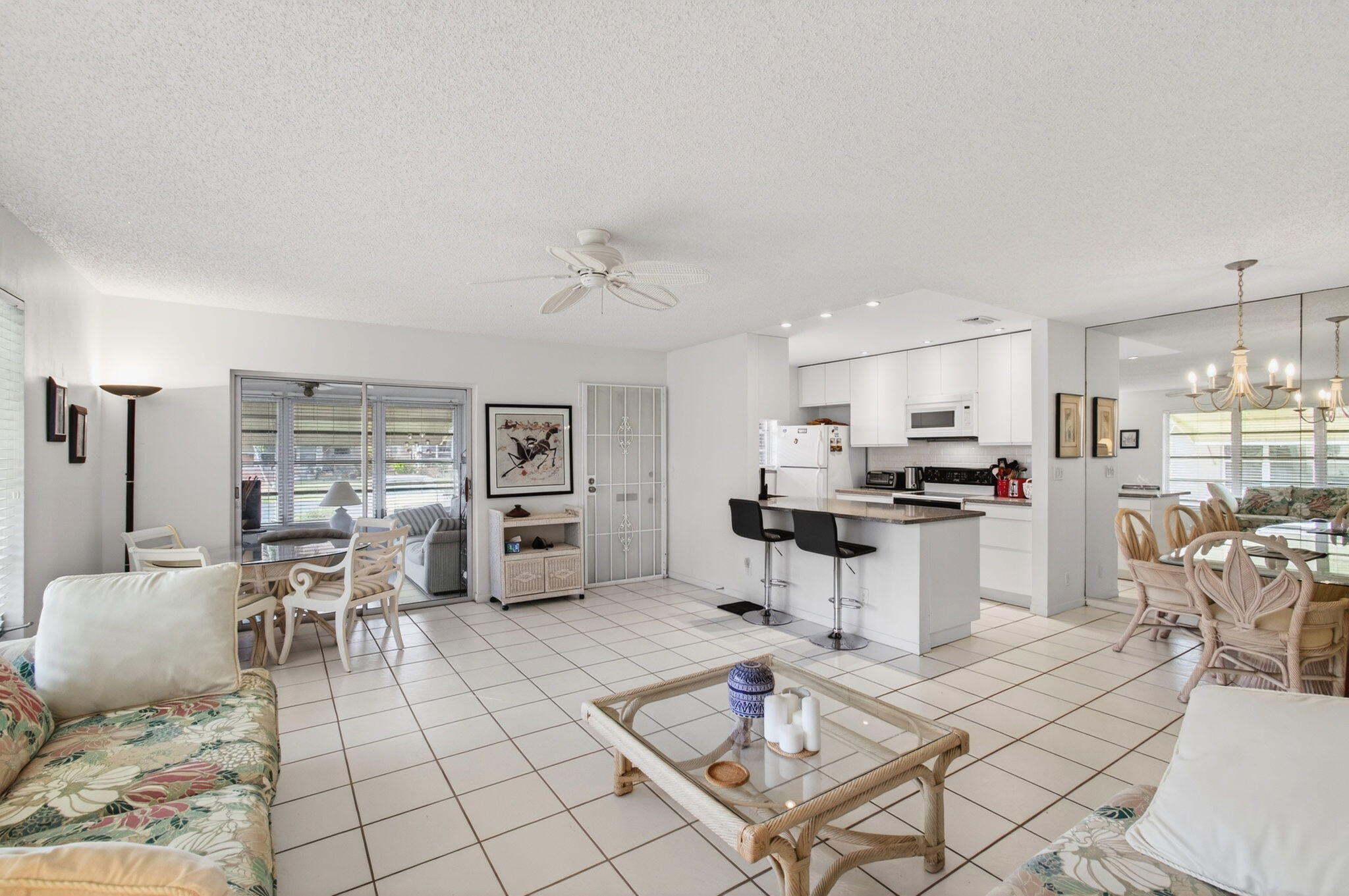 1327 High Point Way Southeast, Unit D Delray Beach, FL 33445 - Photo 14 of 53 a living room with stainless steel appliances kitchen island granite countertop furniture and a view of kitchen