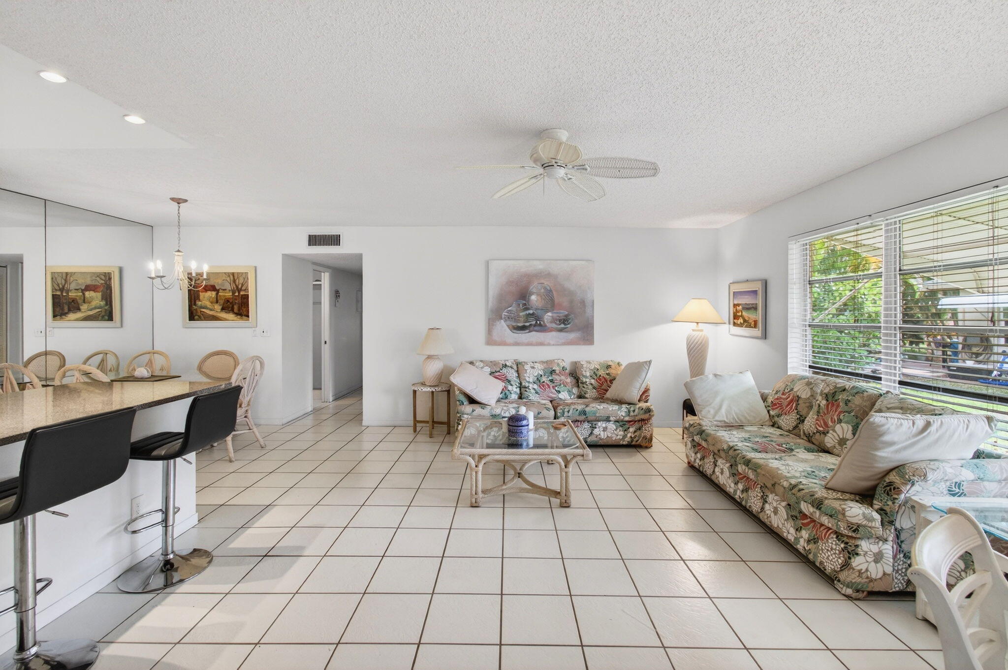 1327 High Point Way Southeast, Unit D Delray Beach, FL 33445 - Photo 15 of 53 a living room with furniture and a large window