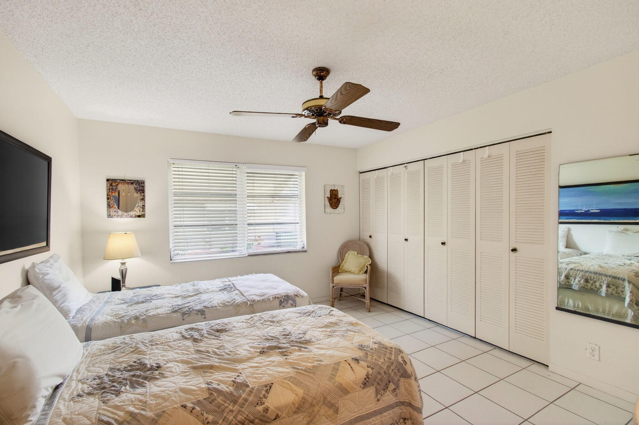 1327 High Point Way Southeast, Unit D Delray Beach, FL 33445 - Photo 27 of 53 a bedroom with a bed and a window