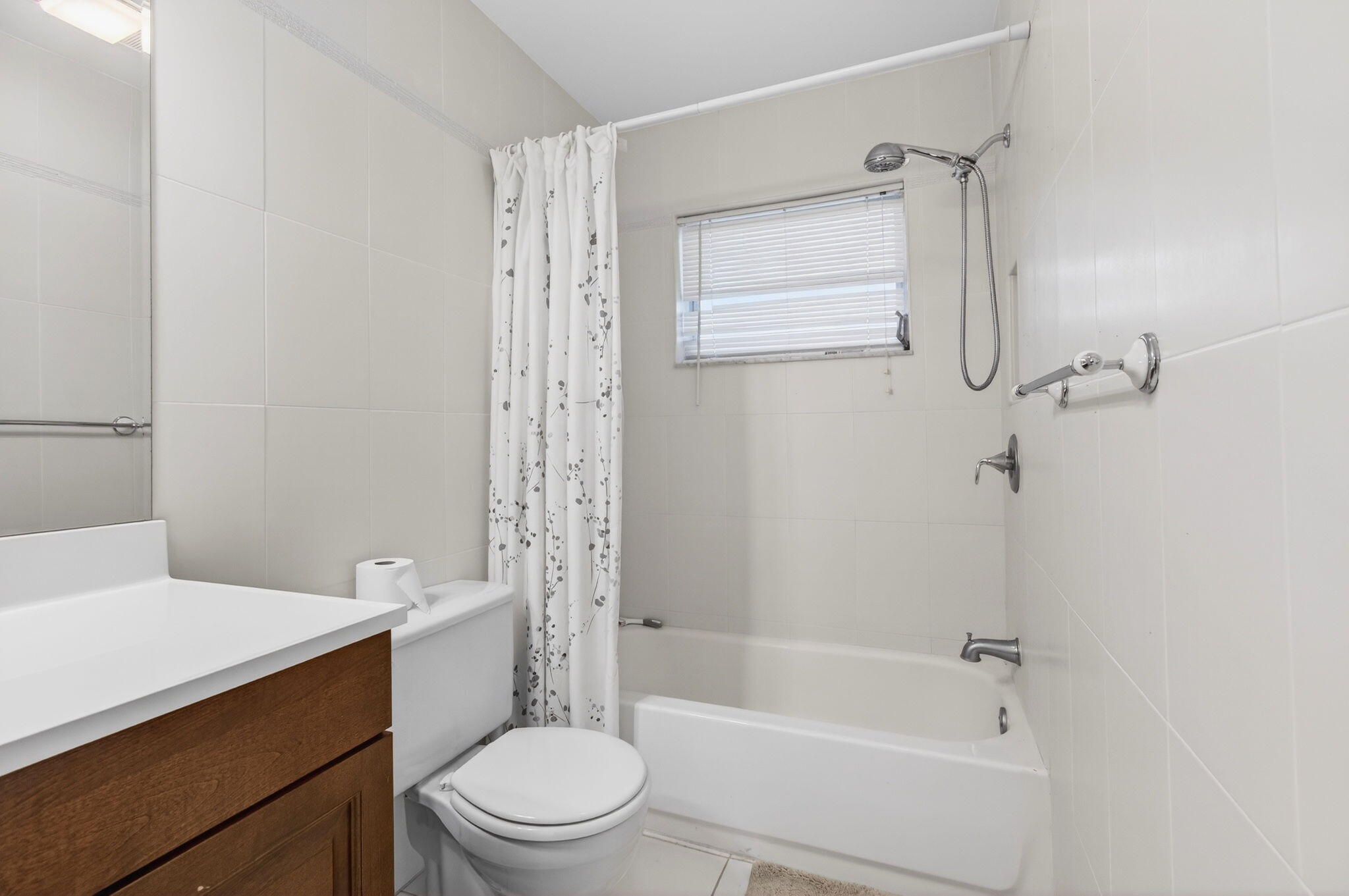 1327 High Point Way Southeast, Unit D Delray Beach, FL 33445 - Photo 34 of 53 a bathroom with a sink toilet and shower