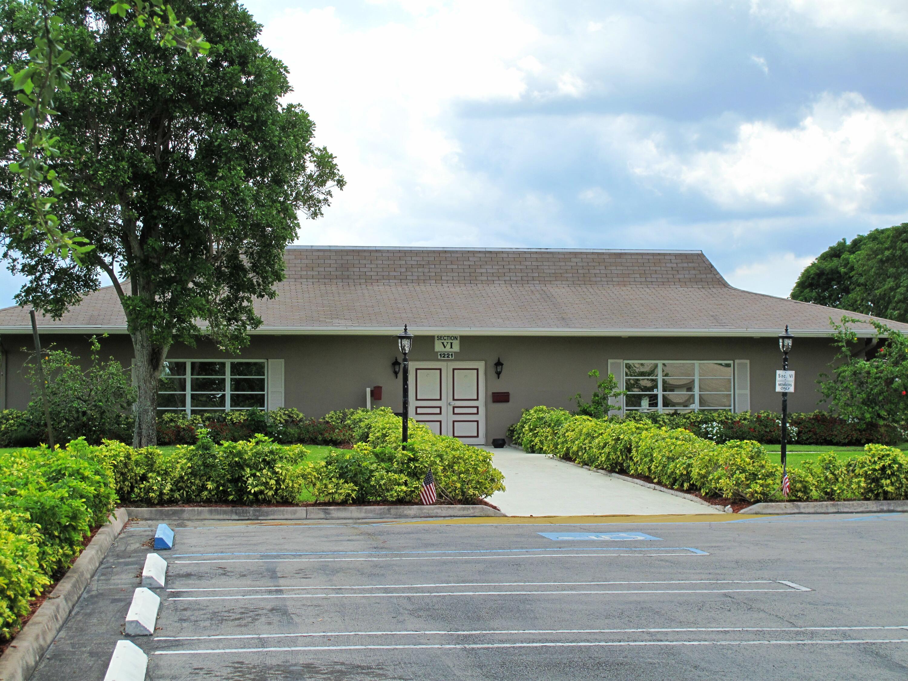 1327 High Point Way Southeast, Unit D Delray Beach, FL 33445 - Photo 42 of 53 front view of a house with a yard