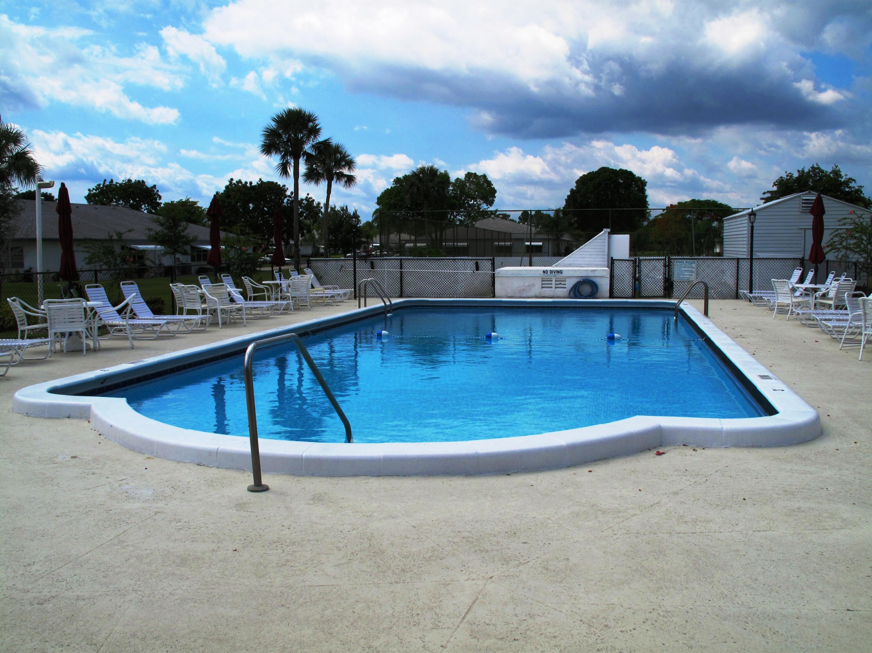1327 High Point Way Southeast, Unit D Delray Beach, FL 33445 - Photo 45 of 53 a view of a swimming pool
