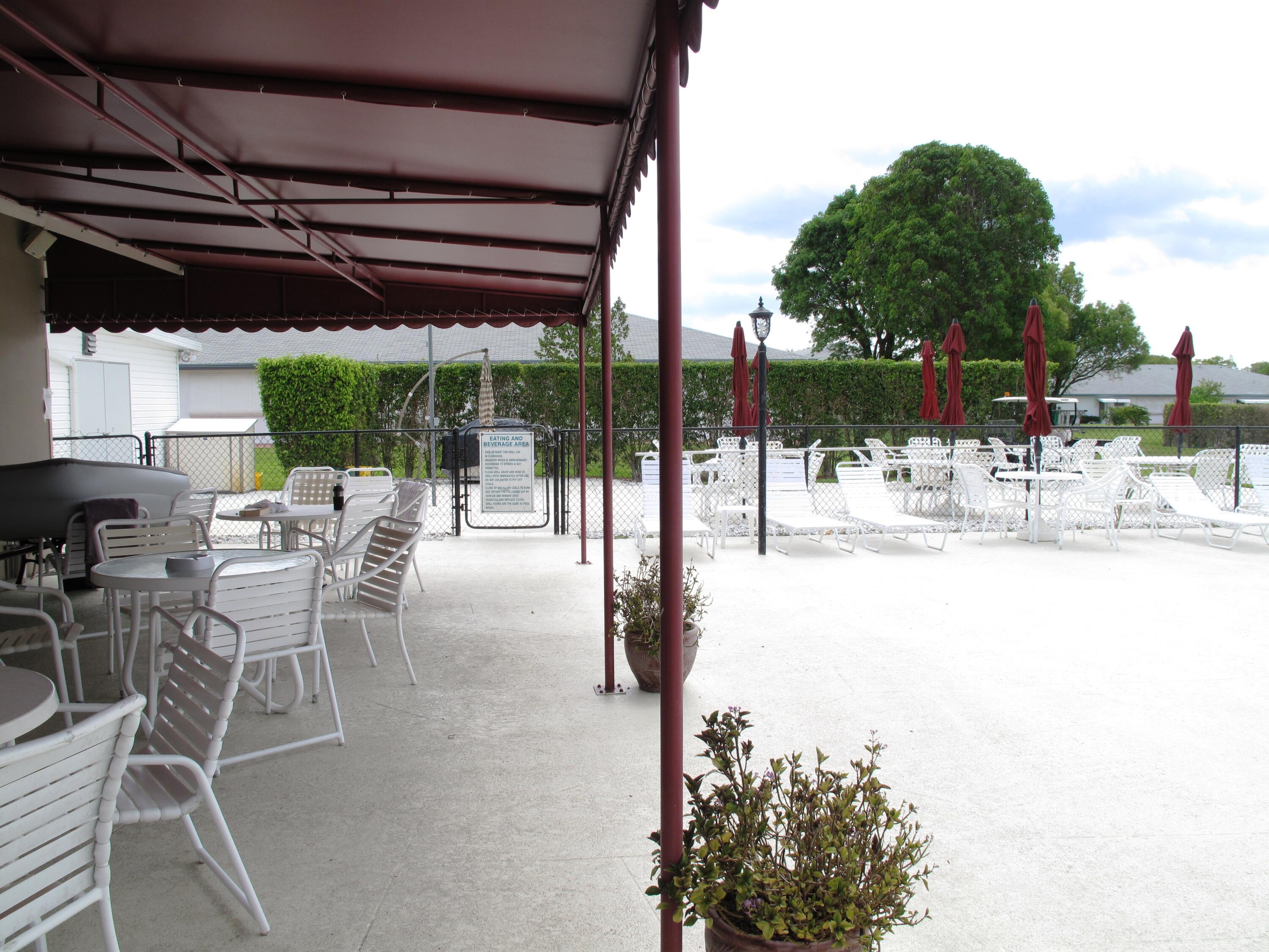 1327 High Point Way Southeast, Unit D Delray Beach, FL 33445 - Photo 46 of 53 a outdoor view with a sitting space