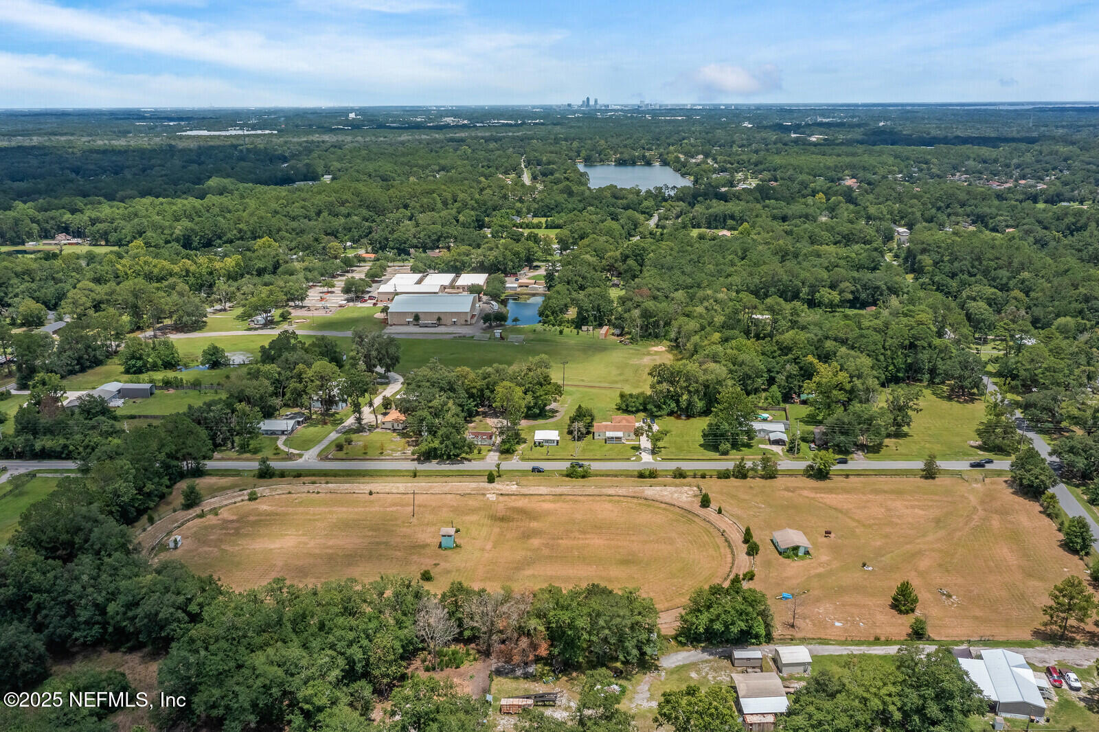 714 Jones Road Jacksonville, FL 32220 - Photo 2 of 12 an aerial view of residential houses with outdoor space and trees