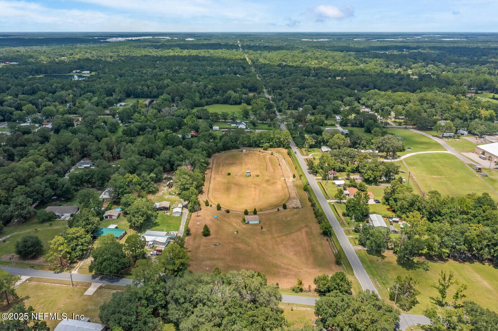 714 Jones Road Jacksonville, FL 32220 - Photo 4 of 12 an aerial view of a residential houses with outdoor space and trees all around