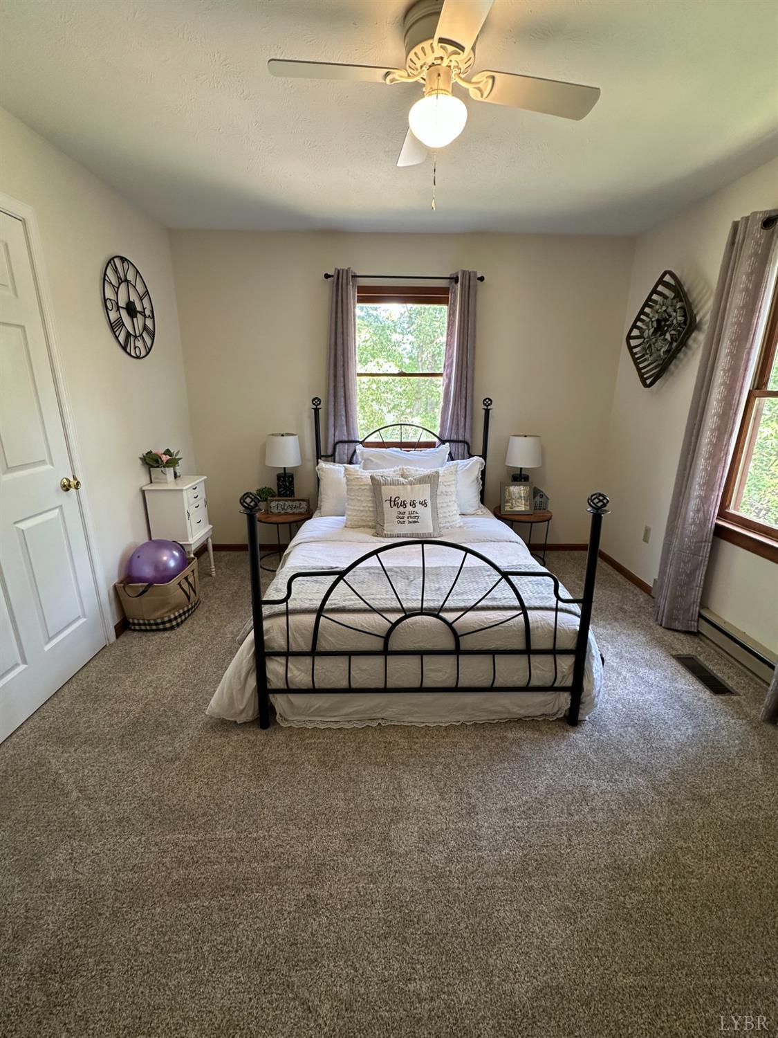 1524 Austin Road Gladstone, VA 24553 - Photo 20 of 30 a bedroom with a bed and a chandelier