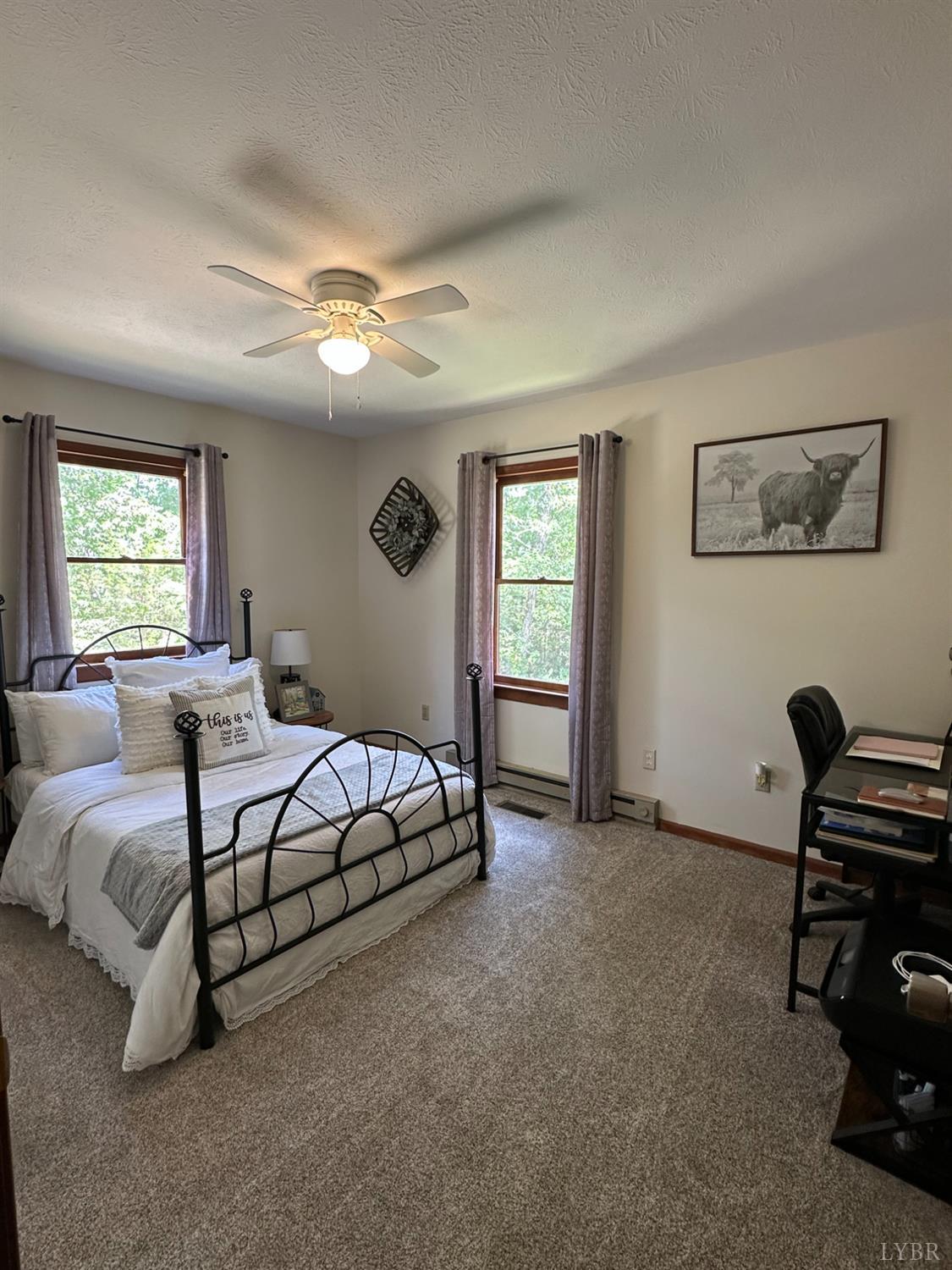 1524 Austin Road Gladstone, VA 24553 - Photo 21 of 30 a spacious bedroom with a bed and a window