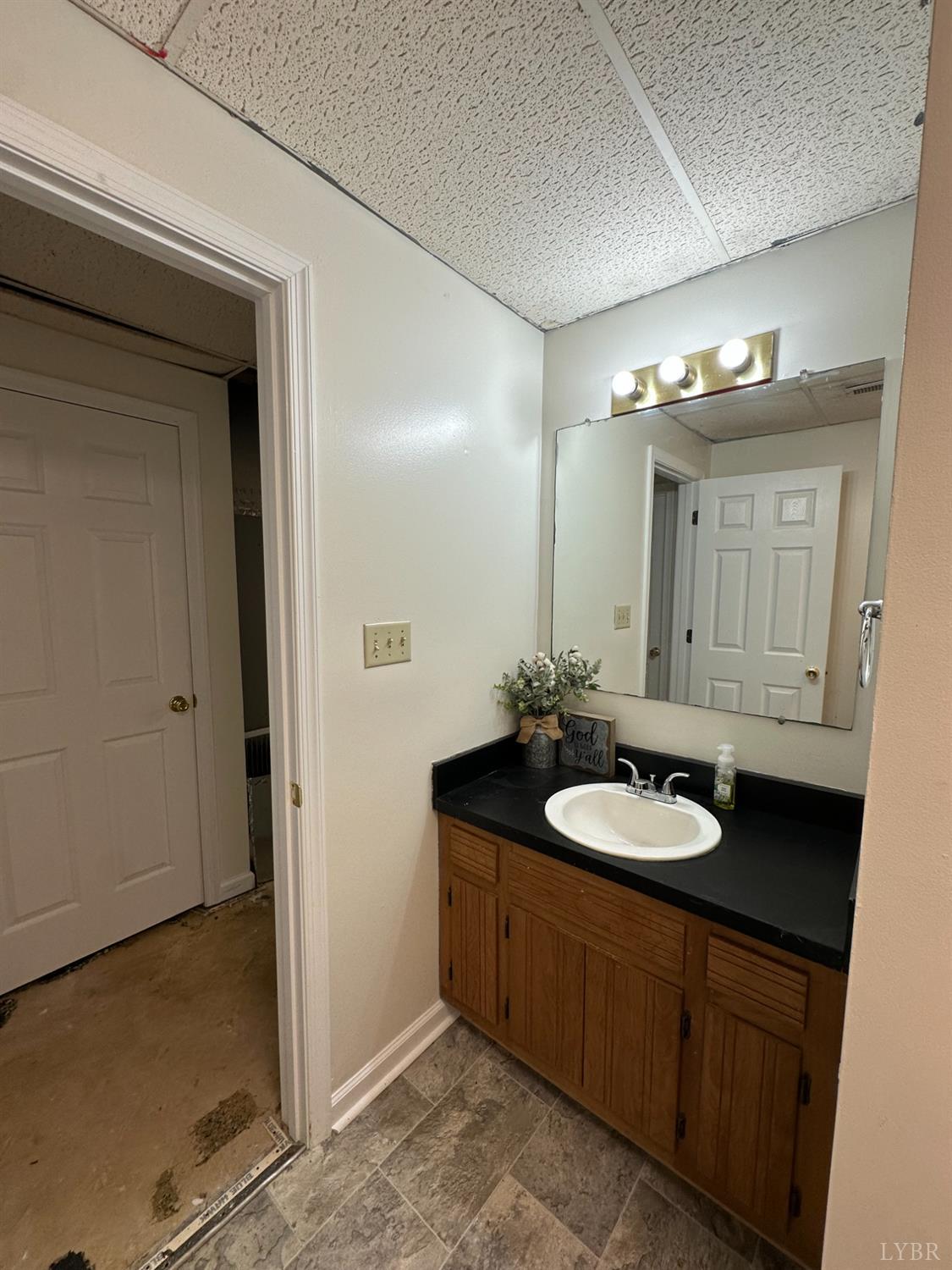 1524 Austin Road Gladstone, VA 24553 - Photo 26 of 30 a bathroom with a sink and a mirror