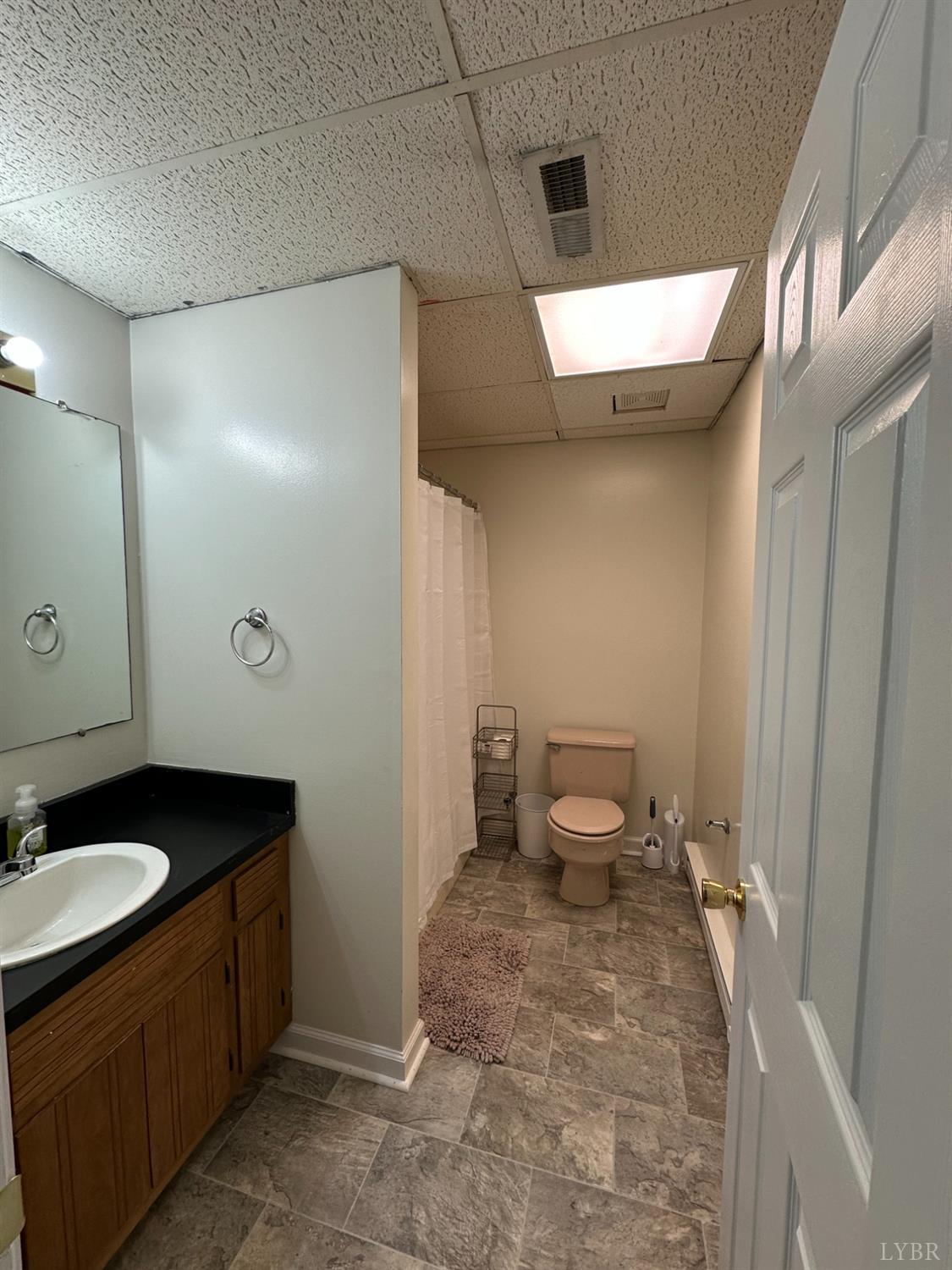 1524 Austin Road Gladstone, VA 24553 - Photo 27 of 30 a bathroom with a sink toilet and shower