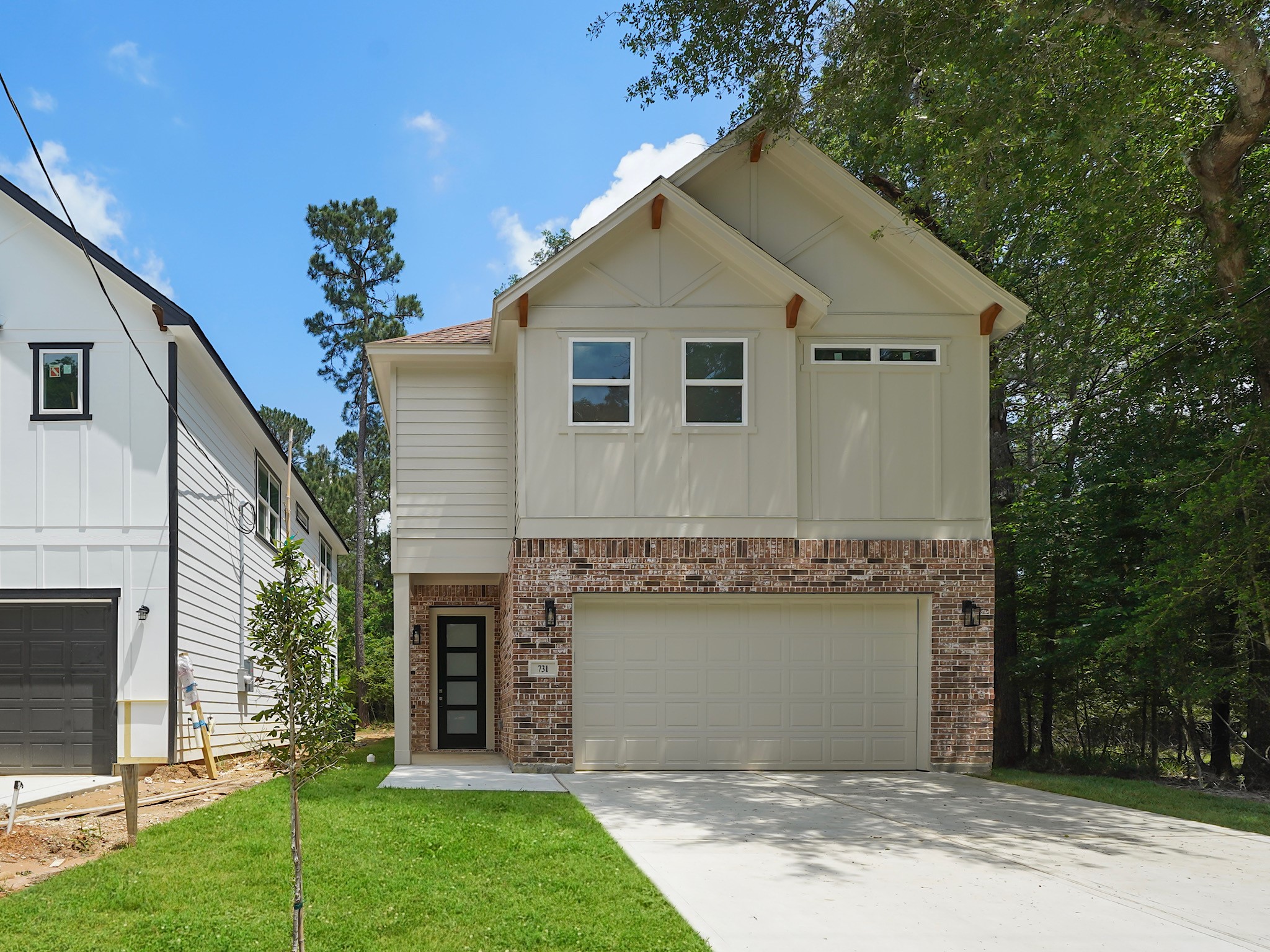 731 Magnolia Point Drive Houston, TX 77336 - Photo 1 of 36 a front view of a house with a garden and yard