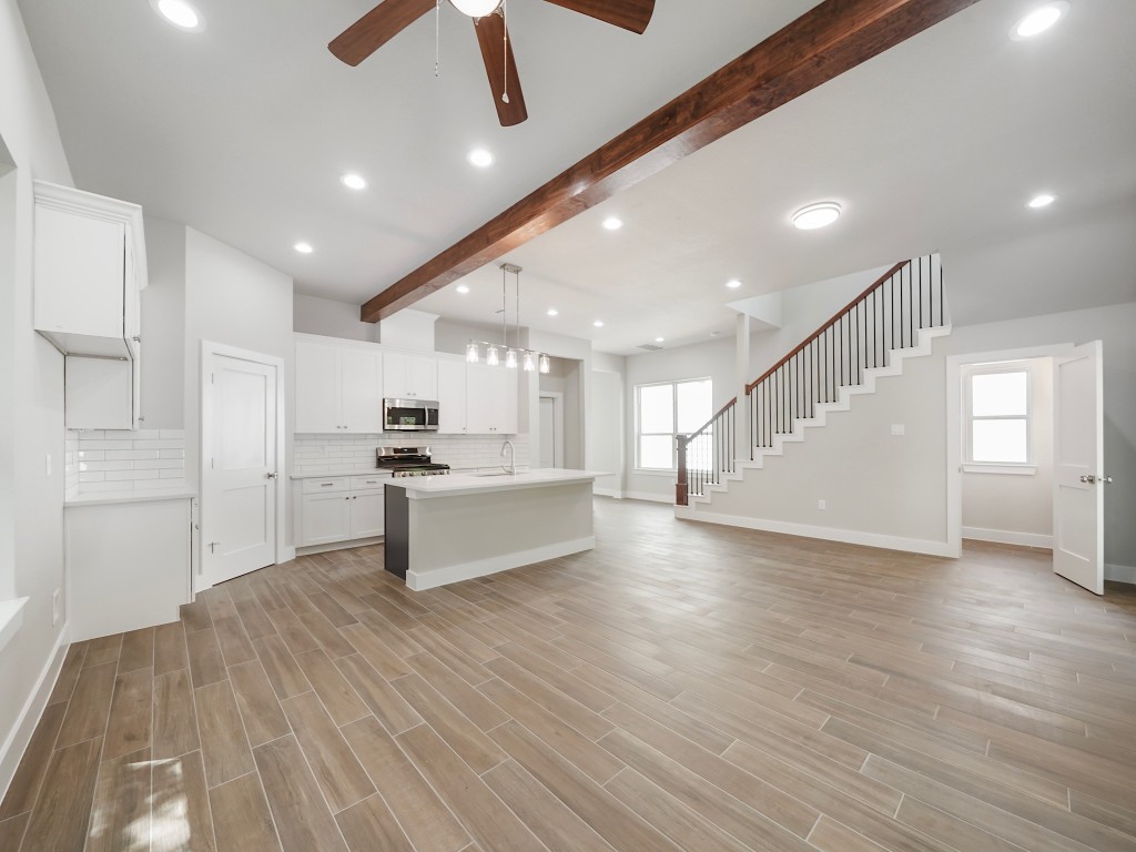 731 Magnolia Point Drive Houston, TX 77336 - Photo 15 of 35 a view of kitchen with cabinets and wooden floor