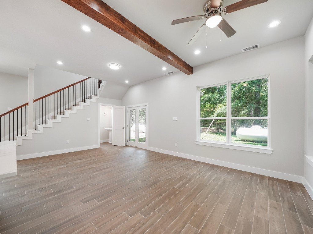 731 Magnolia Point Drive Houston, TX 77336 - Photo 18 of 35 a view of an empty room with wooden floor and a window