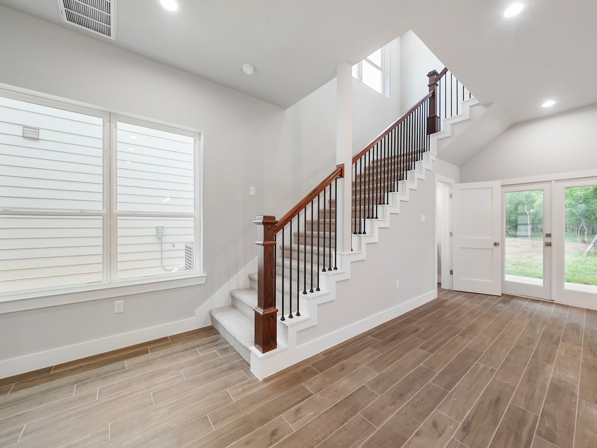 731 Magnolia Point Drive Houston, TX 77336 - Photo 18 of 36 a view of an entryway with wooden floor