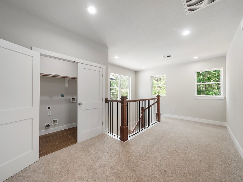 731 Magnolia Point Drive Houston, TX 77336 - Photo 19 of 35 an empty room with windows and closet