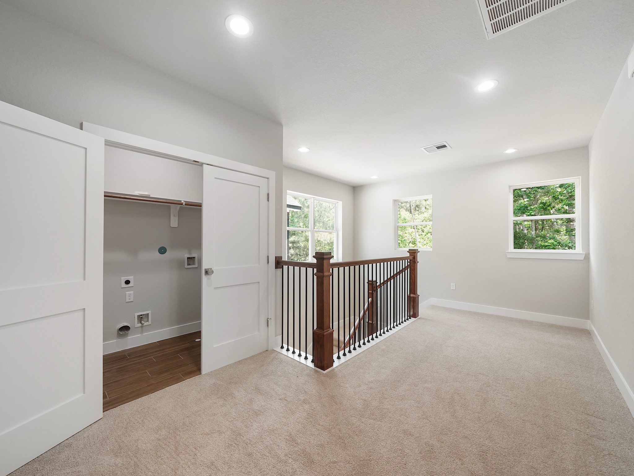 731 Magnolia Point Drive Houston, TX 77336 - Photo 20 of 36 wooden floor and windows in a room