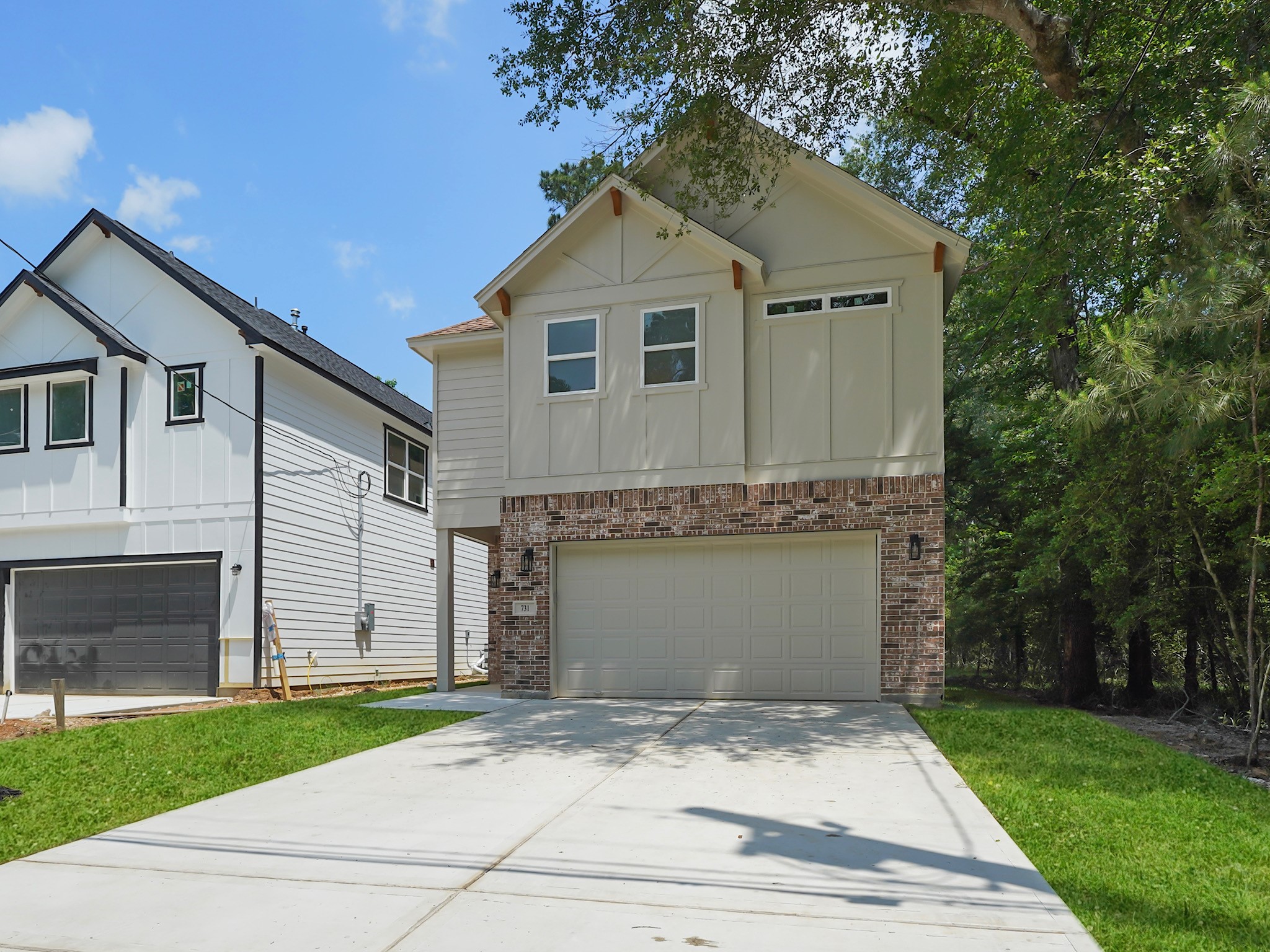 731 Magnolia Point Drive Houston, TX 77336 - Photo 2 of 36 a front view of a house with a garden and garage