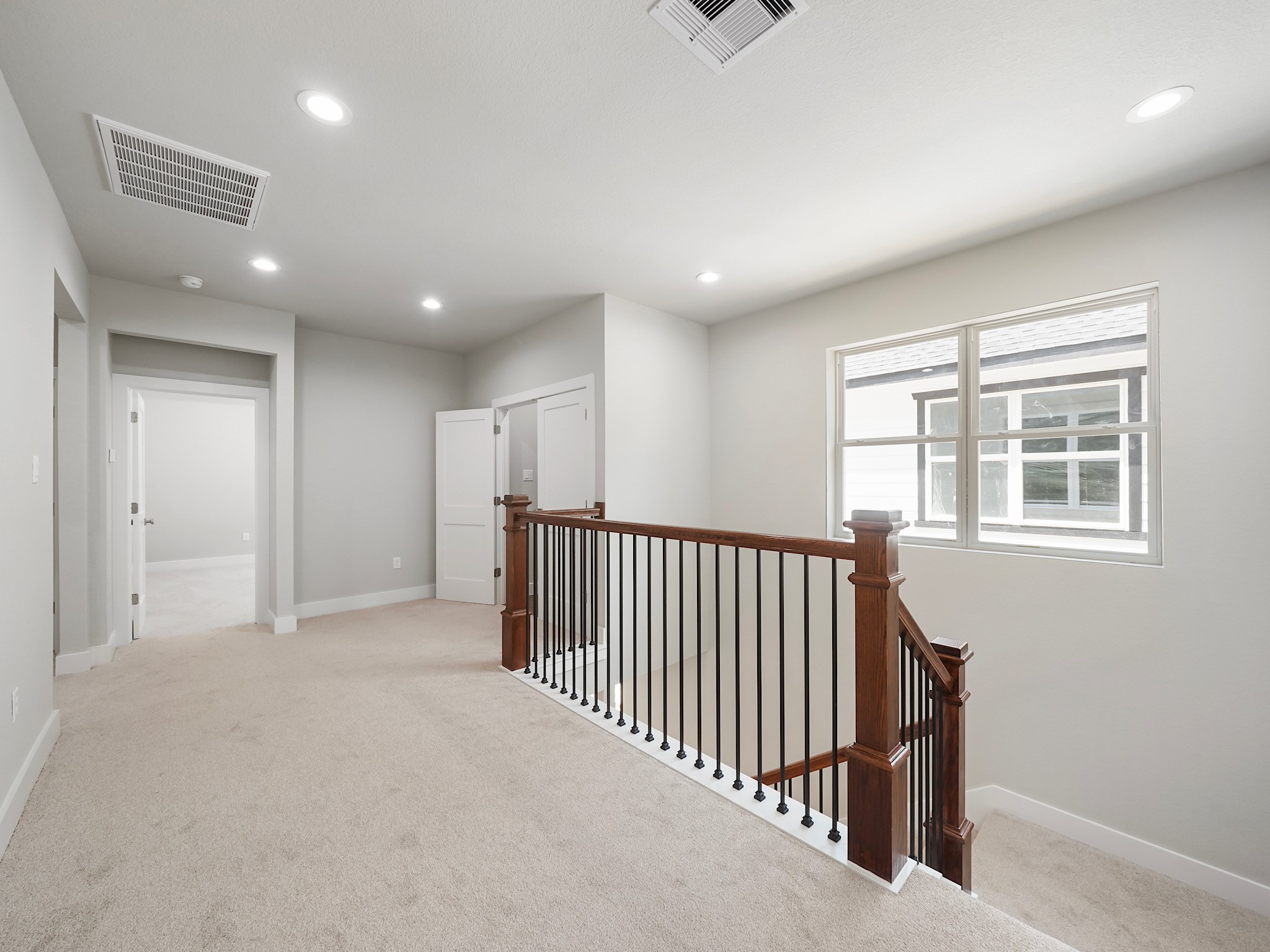 731 Magnolia Point Drive Houston, TX 77336 - Photo 21 of 36 a view of a hallway with windows