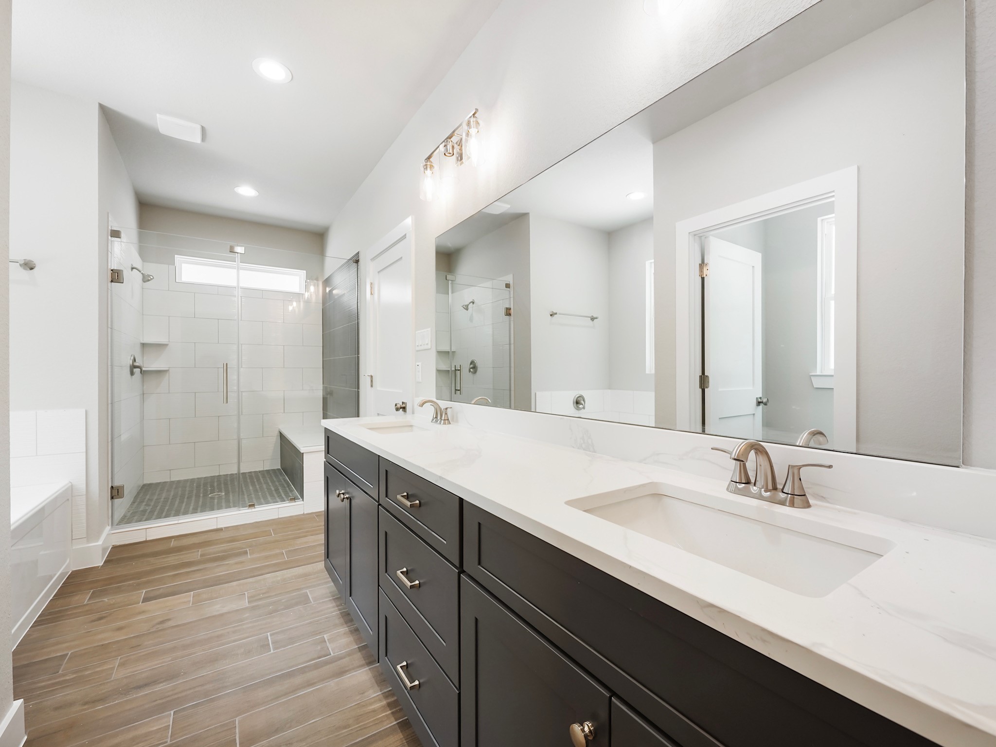 731 Magnolia Point Drive Houston, TX 77336 - Photo 23 of 36 a spacious bathroom with a double vanity sink mirror and shower