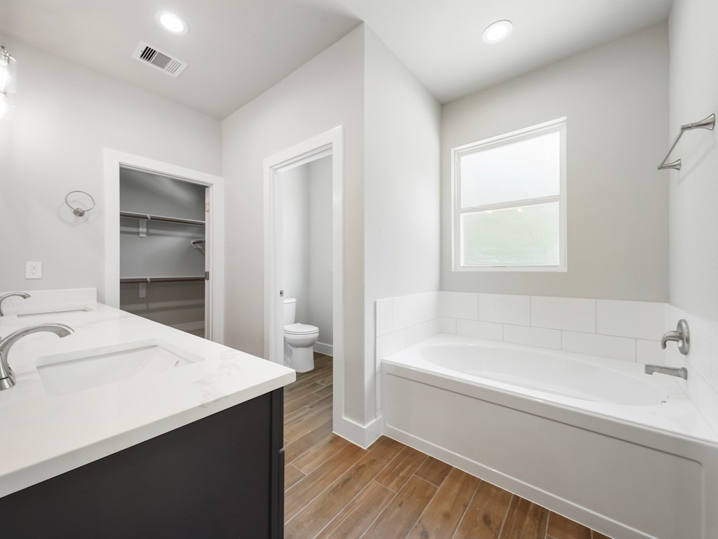 731 Magnolia Point Drive Houston, TX 77336 - Photo 31 of 35 a bathroom with a bathtub and a sink