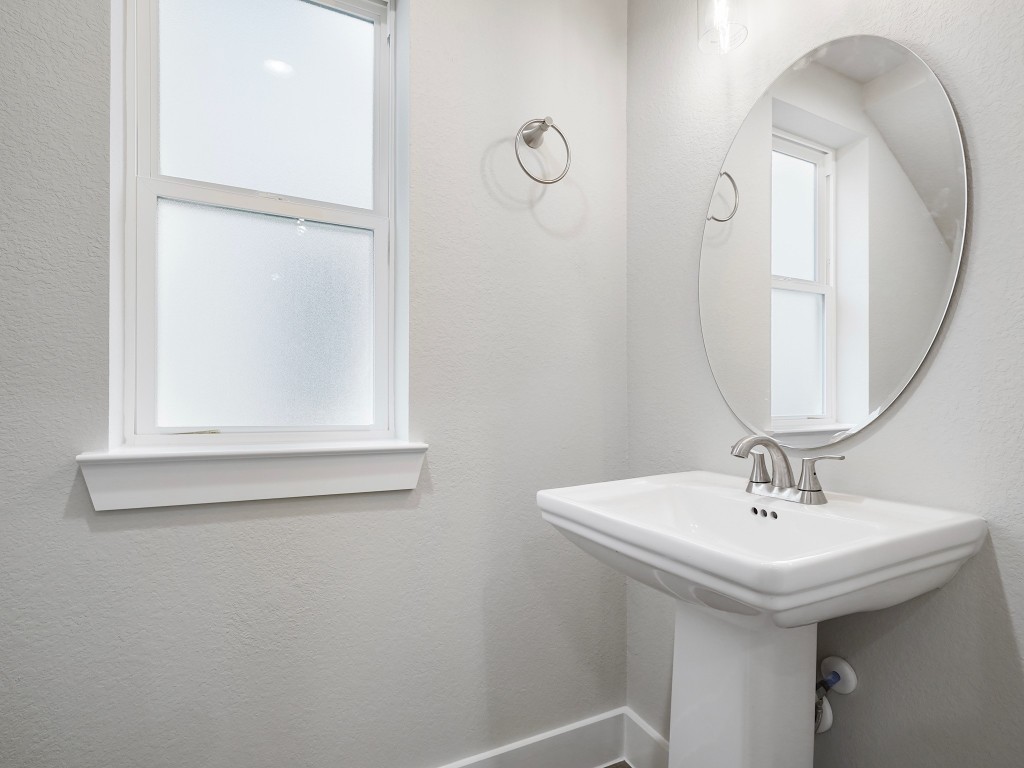 731 Magnolia Point Drive Houston, TX 77336 - Photo 33 of 35 a bathroom with a sink and a mirror