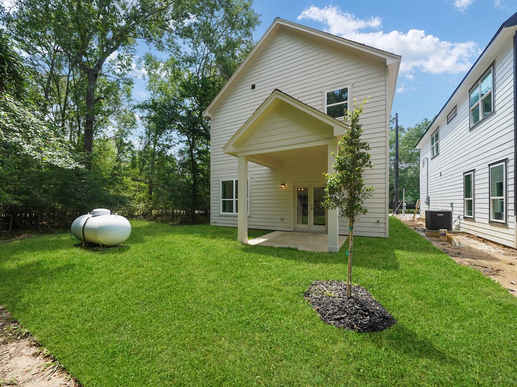 731 Magnolia Point Drive Houston, TX 77336 - Photo 34 of 35 a front view of a house with a yard