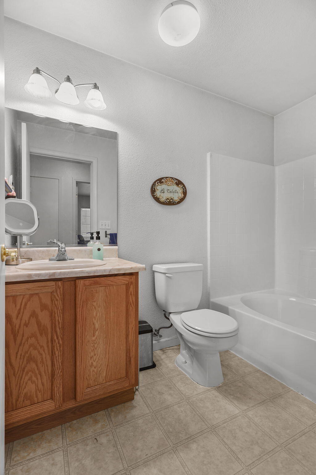 720 Stonebriar Trail Redding, CA 96003 - Photo 12 of 19 a bathroom with a sink a toilet and shower