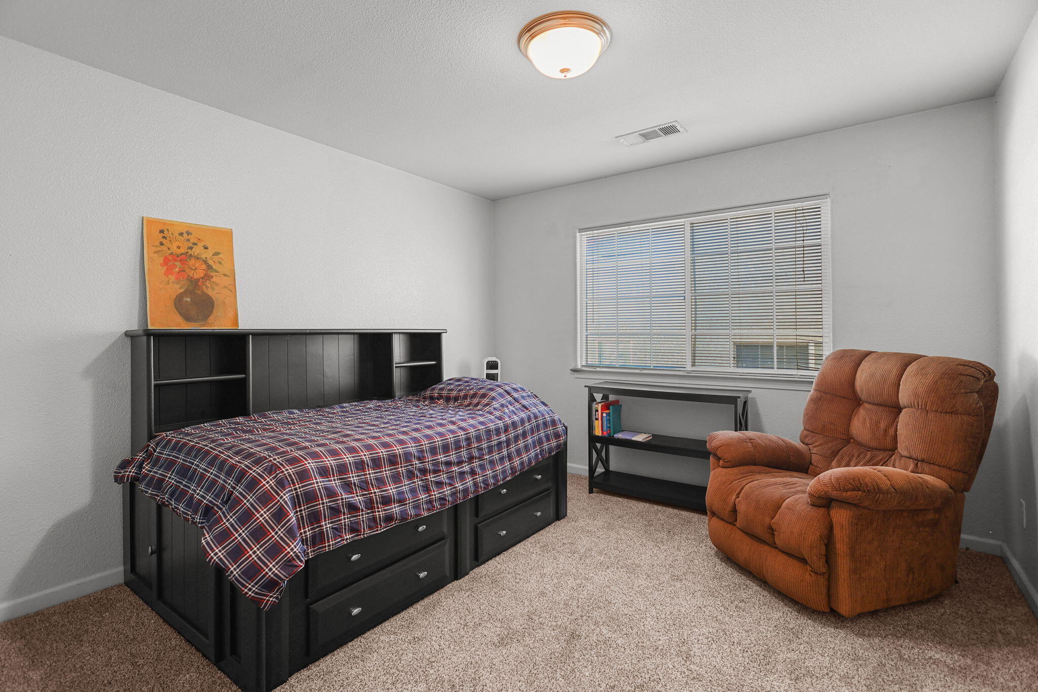 720 Stonebriar Trail Redding, CA 96003 - Photo 13 of 19 a bedroom with a bed couch and window