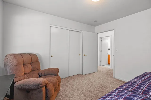 a livingroom with furniture and a wooden floor