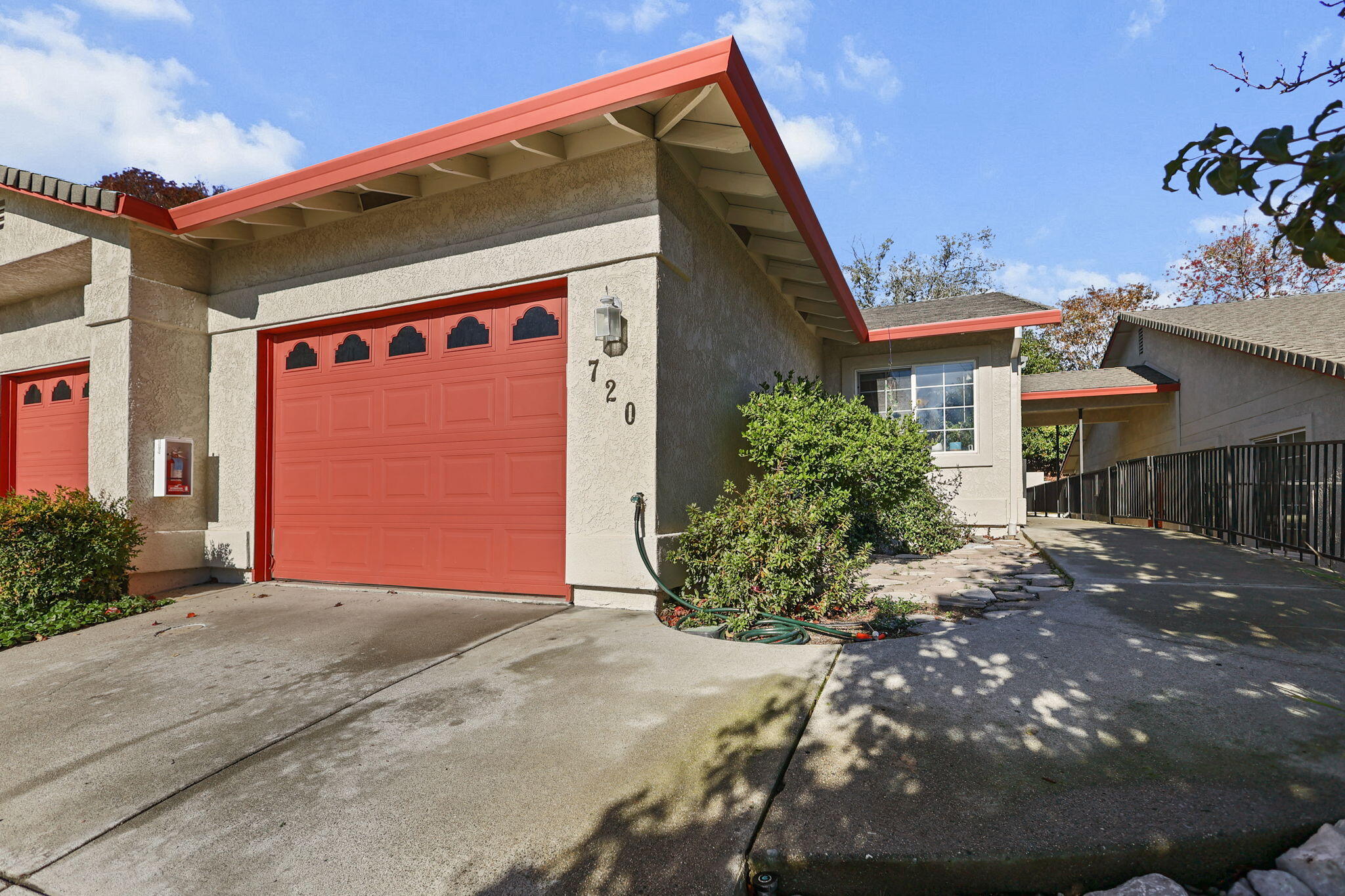 720 Stonebriar Trail Redding, CA 96003 - Photo 2 of 19 a front view of a house with a yard